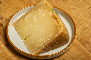 Italian Rodez hard cheese produced with raw cow’s milk, riped 6 months, cheese tasting in Italy