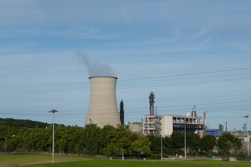 Fototapeta premium Power plant, view on cooling towers located on Maas river, Limburg, The Netherlands, Dutch industry