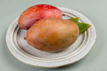 Fresh ripe tropical fruits mango, exotic sweet dessert, juice, healthy food