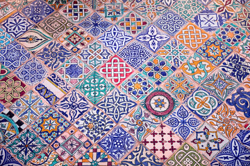 The vibrant tiles display a range of geometric patterns and colors, reflecting the artistry taught at the ceramics school in Fez, Morocco. Each piece tells a story of tradition