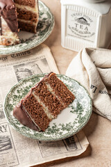 Slice of chocolate layered cake on rustic plate for birthday celebration