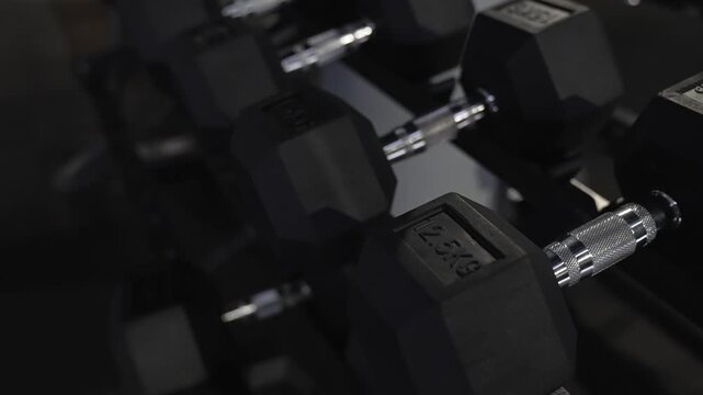 Sport equipment 4k footage. Gym workout equipment. Sport athletic dumbbell. Healthy lifestyle. Fitness gym. Weightlifting gym equipment for fitness. Weightlifting. Wight lifting dumbbell