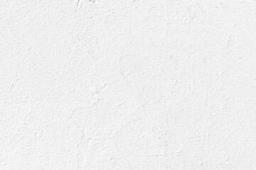 White concrete wall texture background. Uneven render stucco white painted concrete wall texture background. Rough and grunge wall in the sun.