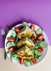 Above Shot of Slices of Shortcrust Pastry Cheddar Cheese and Onion Quiche with Summer Salad, British Savoury Cuisine