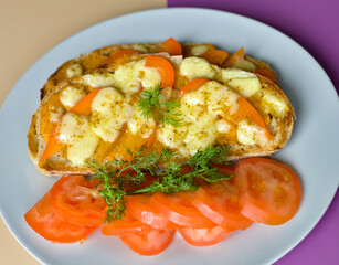 Close-up of Gourmet Vegetable Welsh Cheddar Cheese and Pepper Toast with Fresh Tomatoes and Dill