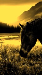 Majestic horse grazing in a sunlit meadow during sunset near a tranquil stream with mountains in the background