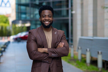 Confident businessman standing in urban city environment