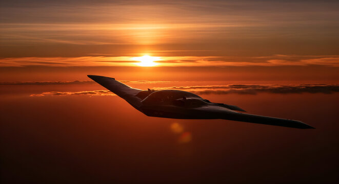 Northrop Grumman aircraft in the foreground, silhouetted against a dramatic sunset. The aircraft is a B-2 Spirit stealth bomber with a sleek, angular design, flying above a layer of clouds.
