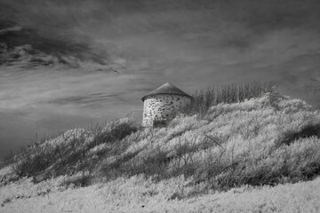 Old mlll on the sand dune