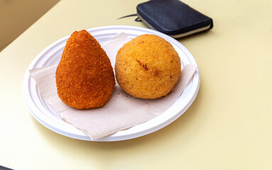 Traditional italian arancini rice balls on plate