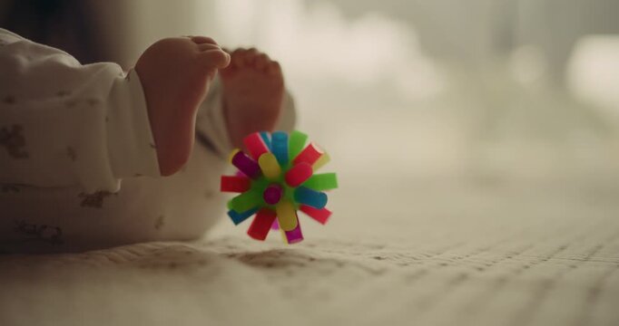 Baby Playing with Rubber Ball