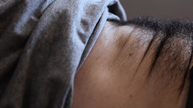 Young man has workout at home or in office during quarantine. Abs training and exercising. Getting better and in fit. Exercising intensive.