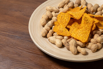 Peanut Butter and Chips on a Wooden Plate on a Wooden Table