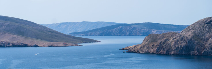 Prvić Island and Sveti Grgur, Croatia - April 20, 2025: Panoramic view of the mountains and sea.