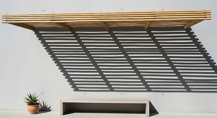 Bamboo shelter casting abstract shadows with a minimalist bench setup