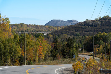 A road amid asbestos wastes mountains