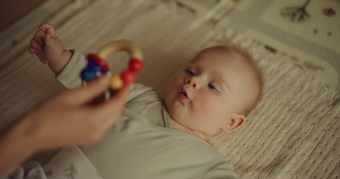 Mother Giving Baby Eco Wooden Toy