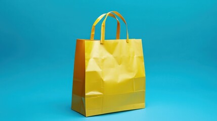 Crumpled, bright yellow paper shopping bag on a vibrant turquoise background.