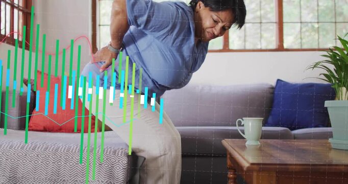 Senior woman pressing lower back pushing on seat standing while pain indicator rising health chart