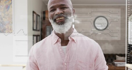 Man standing before camera upon world map overlay emerging and panels sliding, tracking tech data - Powered by Adobe