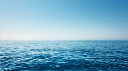 Obraz premium Endless calm ocean horizon with clear blue sky, minimalist seascape background, clean mockup ready.