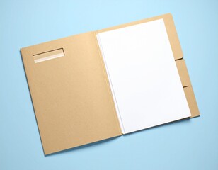 Open manila folder holding blank white papers on blue surface