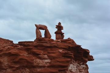 Red Sandstone Cairn on Coastal Cliff