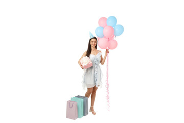 Woman in festive outfit with balloons and gifts, on white background