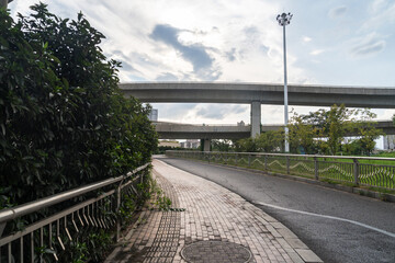 Concrete structure and asphalt road space under the overpass in the city