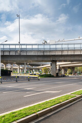 Obraz premium Concrete structure and asphalt road space under the overpass in the city