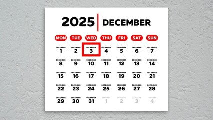 The date December 3rd marked with a red cursor on the wall calendar 2025