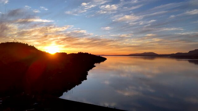 4K Aerial Drone Footage of a Lake with Orange Sunset Light