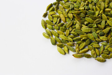Green cardamom pods with aromatic and medicinal benefits.