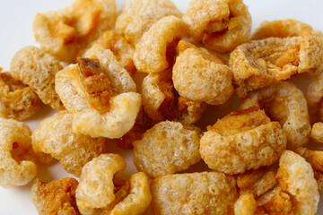Crispy pork cracklings, a crunchy savory snack.