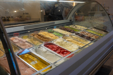 Variety of Colorful Gelato Flavors Displayed in a Dessert Shop