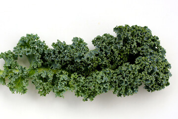 Fresh curly kale leaves with textured green surface.