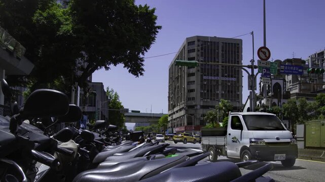 A timelapse of traffic jam near the scooter parking at Linsen N Rd in Taipei panning