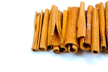 Dried cinnamon sticks arranged in a bundle.