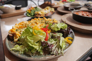 Delicious lunch platter featuring fresh salad and baked dish