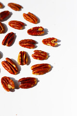 Delicious salted pecan nuts scattered.
