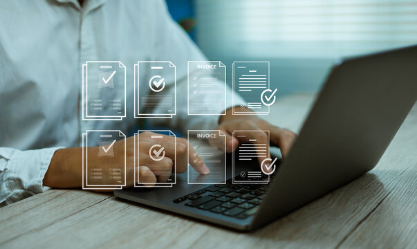 Man typing on laptop with digital receiving invoice and document management icons. Business accounting, data processing, and automation technology for financial operations productivity - Powered by Adobe