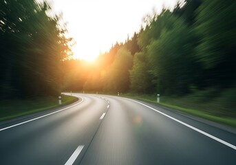 Fototapeta premium Winding road through idyllic forest at sunrise offers scenic journey