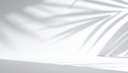 Fototapeta premium Blurred shadow from palm leaves on the white wall. Minimal abstract background for product presentation. Spring and summer.