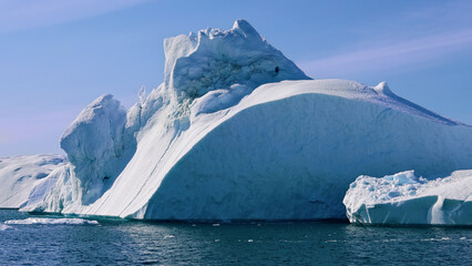 Boat excursion near icebergs of Kangia Fjord and Sermeq Kujalleq glacier in Ilulissat, Greenland © eskystudio