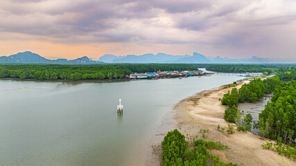 Built beside the mangrove-lined shores, the lighthouse overlooks a narrow but deep tidal channel that leads from a coastal Bang Phat fishing village at Phang Nga to the vast sea beyond.