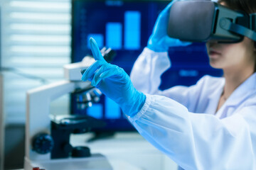 An Asian female scientist in a modern lab interacts with 3D holographic data using VR/MR headset, integrating microscopy, chemical analysis,computational biotechnology immersive, advanced scientific