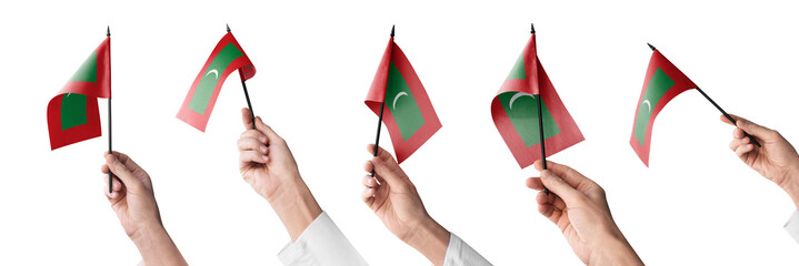 The Maldives flag in hand in different angles on a white background