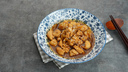 Teriyaki Chicken with onion, soy sauce, butter and sesame seeds