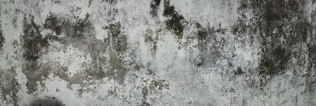Old weathered surface with cracked paint and crumbling plaster. Aged concrete wall texture creating grunge industrial look. Rough distressed background panoramic design.