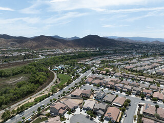 Aerial view of a sprawling neighborhood of family homes in Menifee city in Riverside County, California, United States